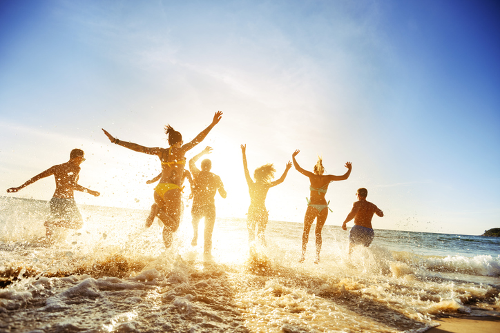 Crowd people friends sunset beach holidays