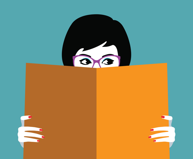 Beautiful girl face behind big book best