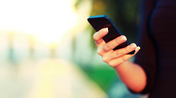 Closeup,Of,Female,Hand,Using,A,Smart,Phone.,Shallow,Depth on-demand