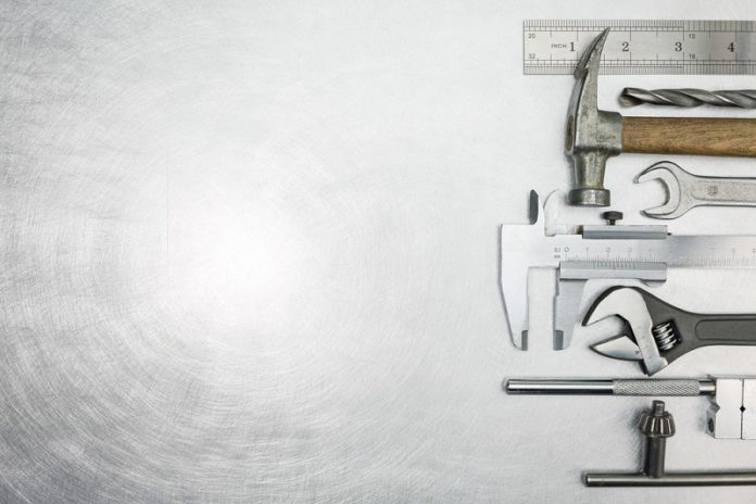 Set,Of,Metal,Working,Tools,On,Scratched,Background tools