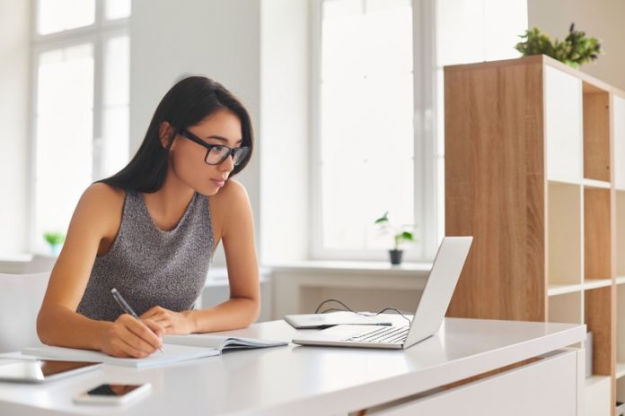 Serious,Young,Woman,Enjoying,Self-directed,Learning,With,Online,Educational,Tools. business